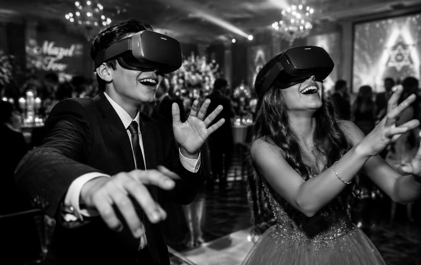 Boy and girl wearing VR headsets at a mitzvah celebration